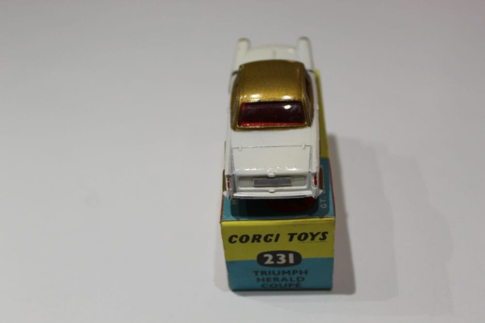Vintage Corgi Toys 231 Triumph Herald Coupe diecast model on display.