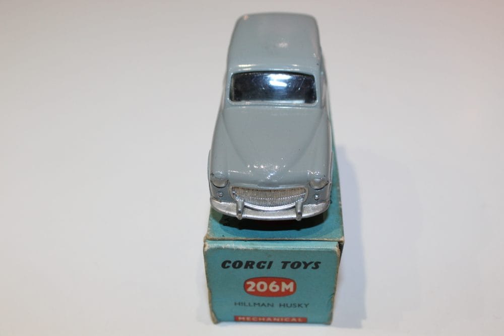 Detailed model of Corgi Toys 206M Hillman Husky Estate in grey with original packaging.