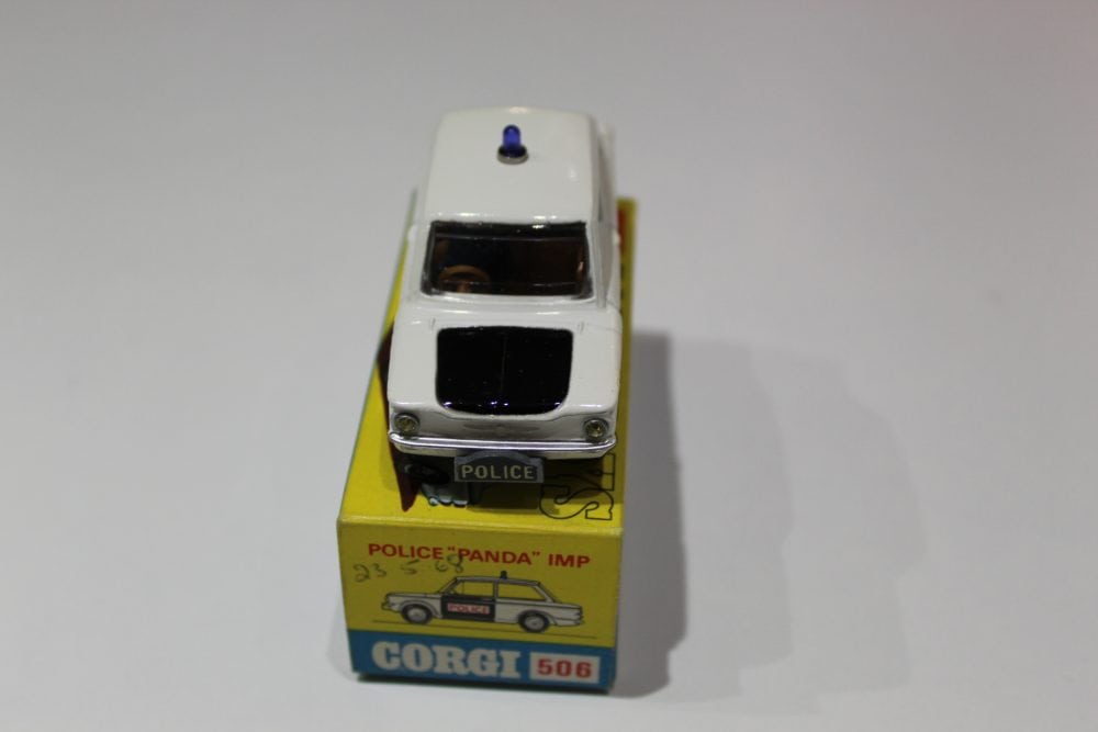 Vintage Corgi Police Panda Imp diecast model car, white with police markings.
