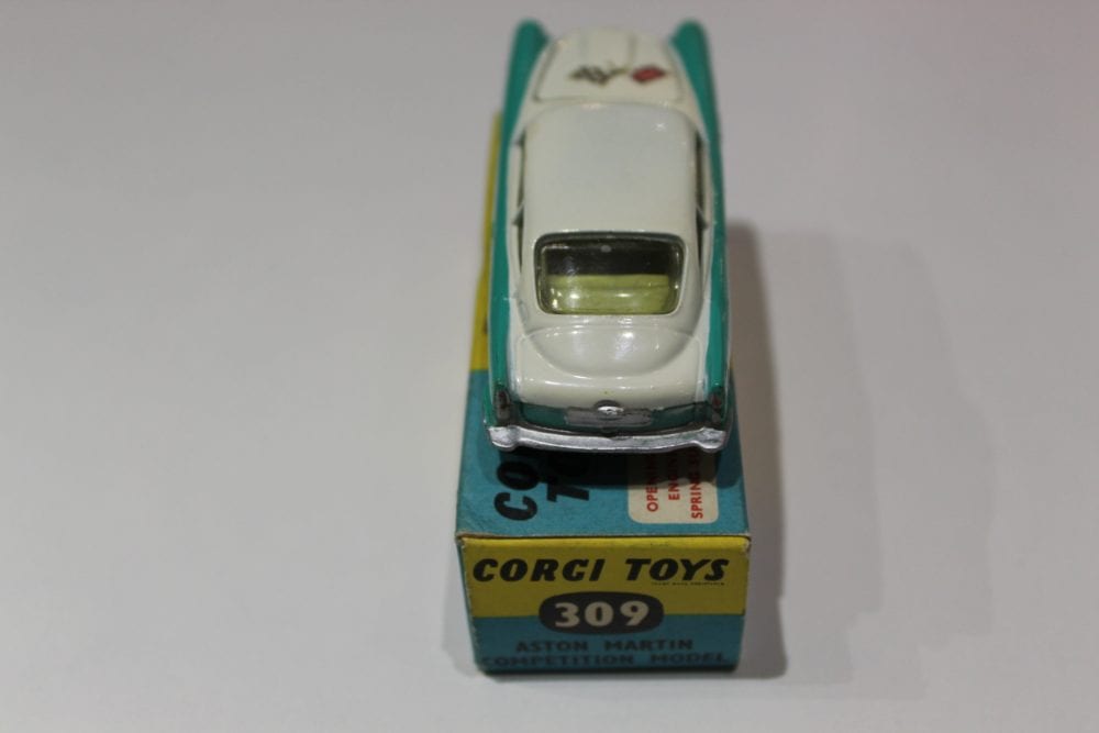 A detailed view of the Corgi Toys 309 Aston Martin DB4 model car on its original box, showcasing cla.
