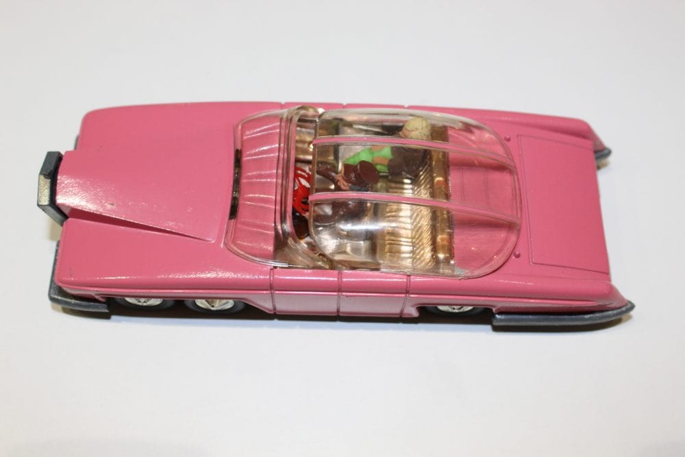 Dinky Toys 100 Lady Penelope's FAB 1 diecast model car in pink with detailed interior.