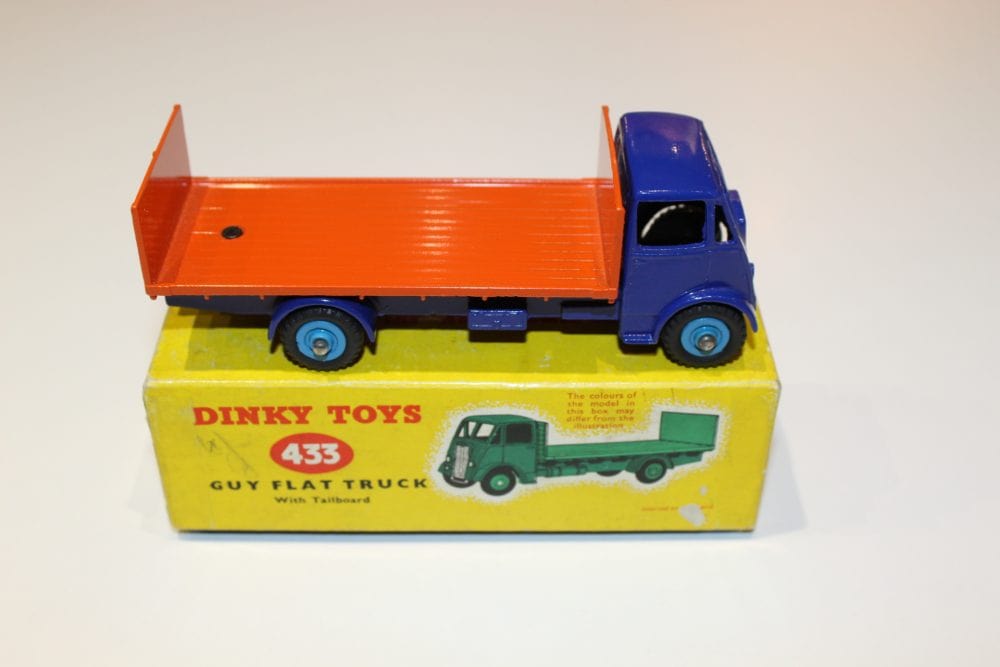 Dinky Toys 433 Guy tailboard lorry toy on yellow box, vintage diecast model for collectors.