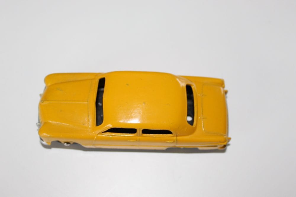 Vintage yellow Dinky Toys Ford Forder model for collectors.
