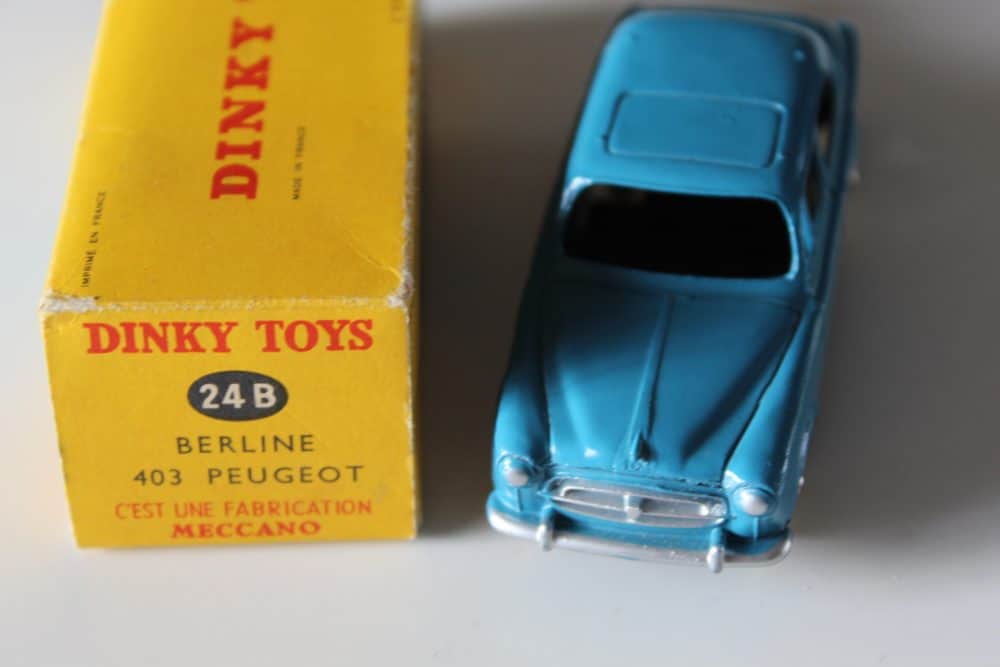 Dinky Toys 24B Peugeot 403 Berline model car with original box, vintage diecast toy.