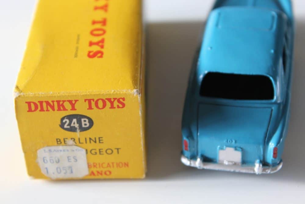 Dinky Toys 24B Peugeot 403 Berline diecast model car with original box, vintage collectible.