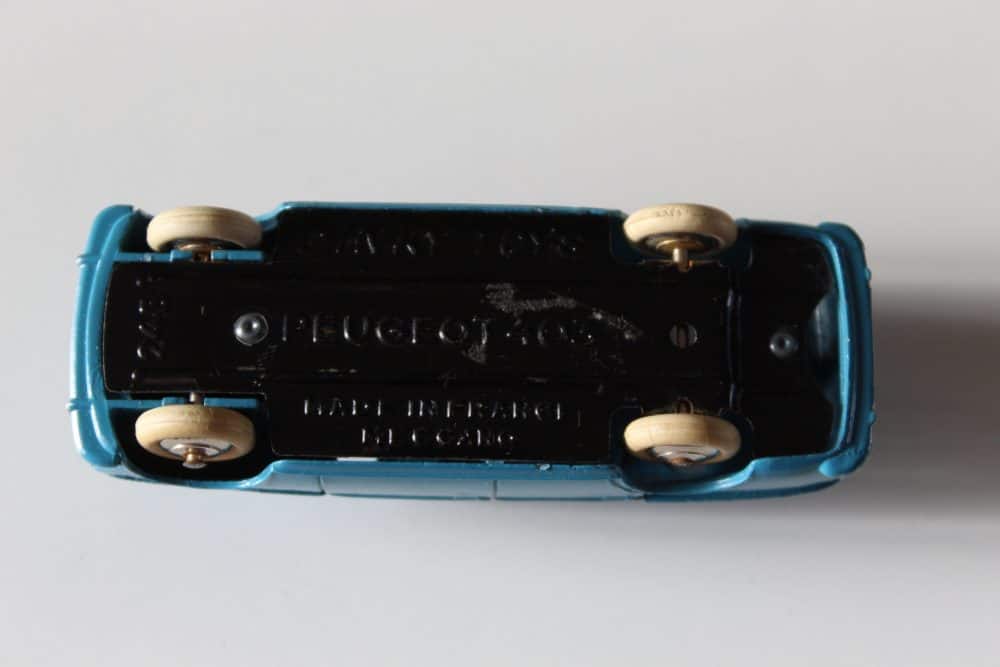 Vintage Dinky Toys 24B Peugeot 403 Berline diecast model car, blue with white wheels.