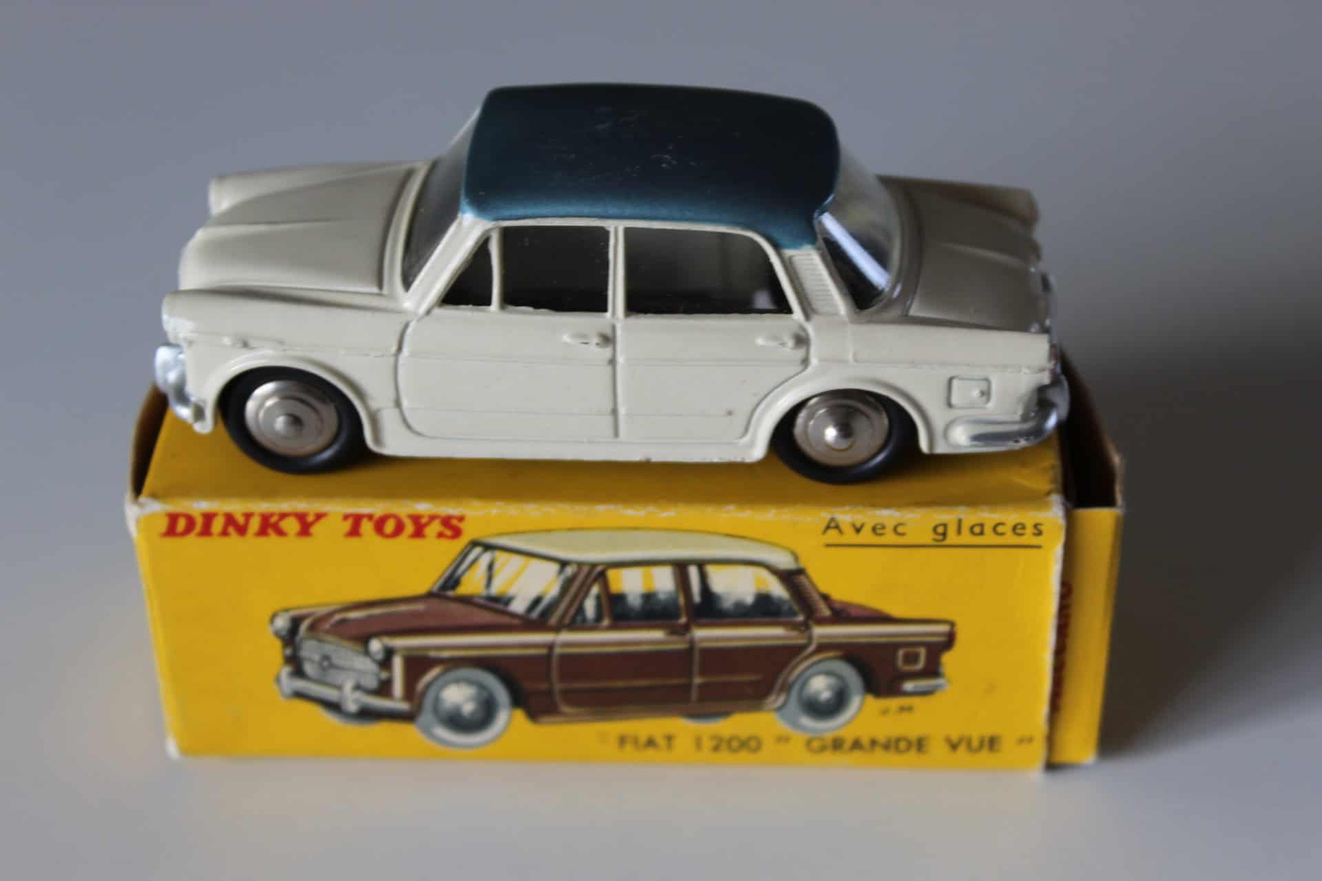 Vintage Dinky Toys 531 Fiat 1200 model car with black roof, detailed miniature collectible.
