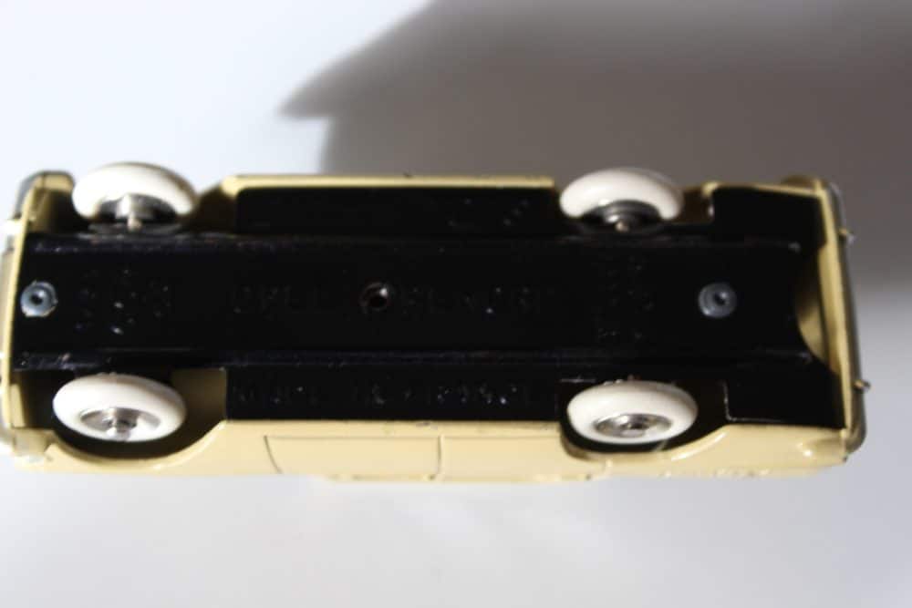 Detailed view of vintage Dinky Toys 554 Opel Rekord model car, underside perspective.