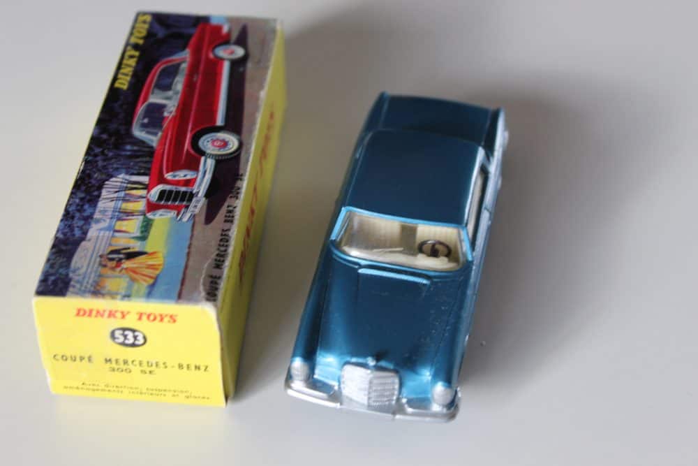 Vintage Dinky Toy 533 Mercedes Benz 300 SE Coupe model in blue with original box.