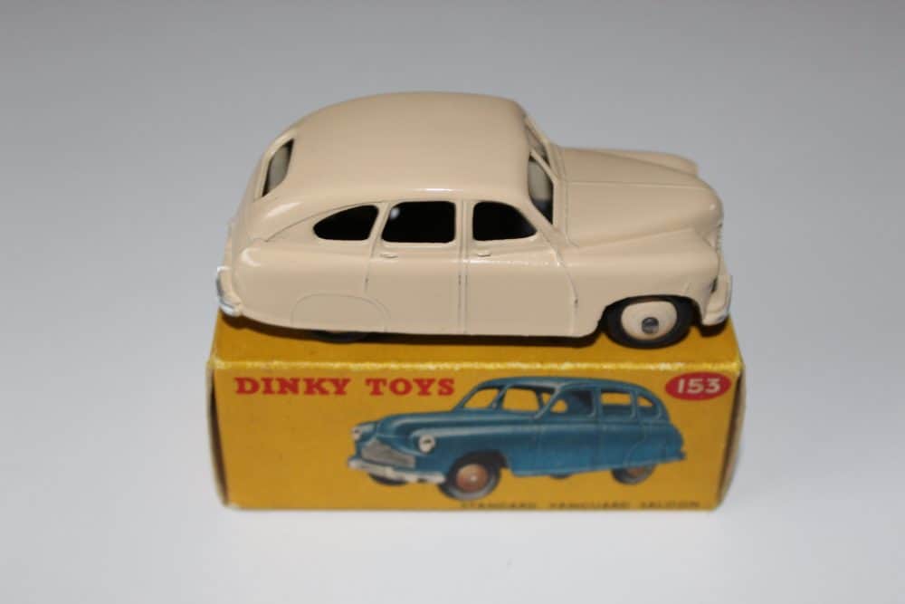 Dinky Toys 153 Standard Vanguard diecast model on original box, vintage collectible.