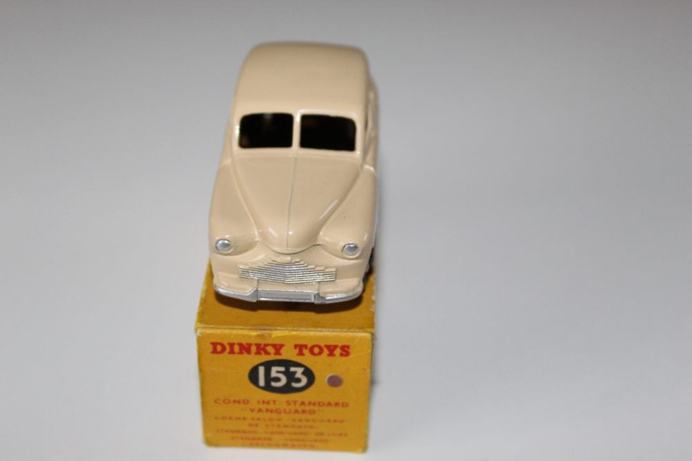 Vintage Dinky Toys 153 Standard Vanguard model car on box.