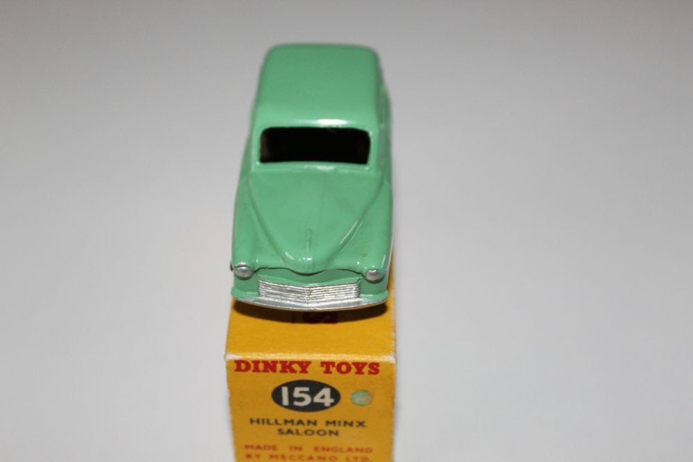 Vintage Dinky Toys 154 Hillman Minx diecast model car, green color, with original packaging.