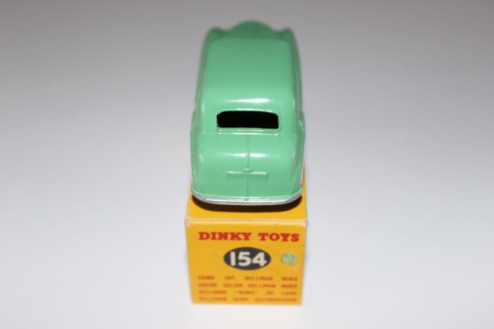 Dinky Toys 154 Hillman Minx diecast model car on display, vintage toy collectible.