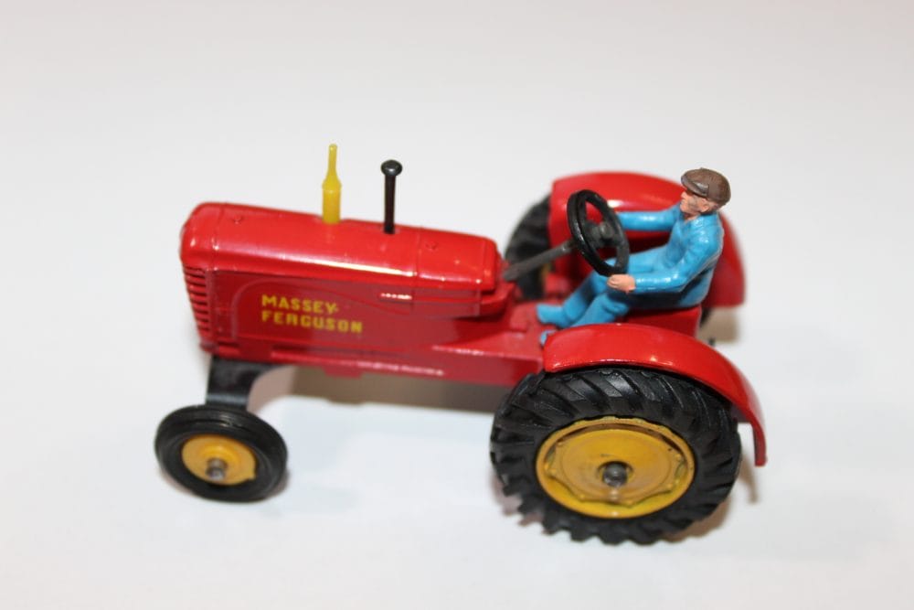 Vintage Dinky Toys Massey Ferguson tractor with driver figure.