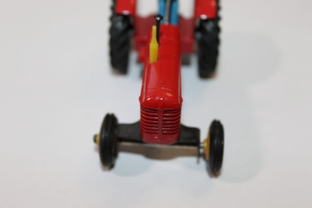 Vintage Dinky Toys Massey Ferguson tractor model for collectors.