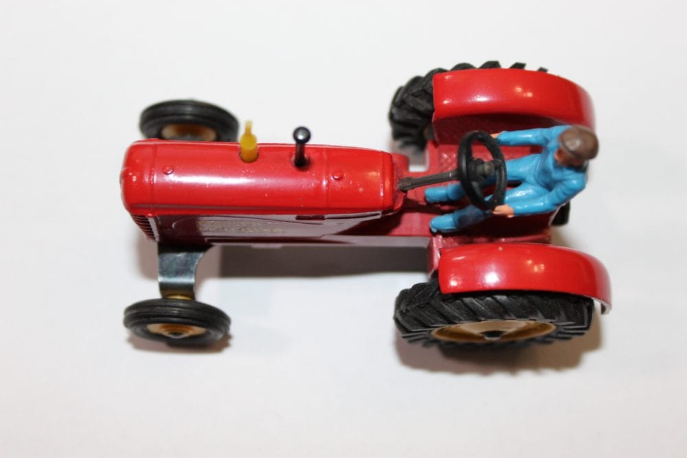 Vintage Dinky Toys Massey Ferguson tractor model for collectors.