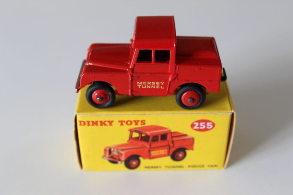 Vintage Dinky Toys Mersey Tunnel Police Van model, red diecast miniature with black wheels.