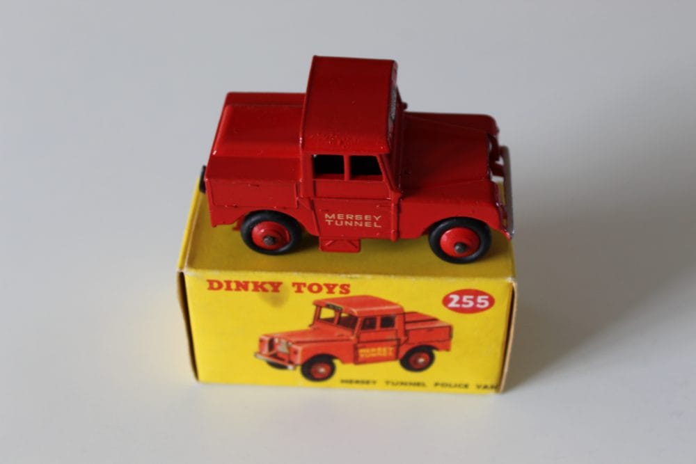 Vintage Dinky Toys Mersey Tunnel Police Van model on yellow box display.