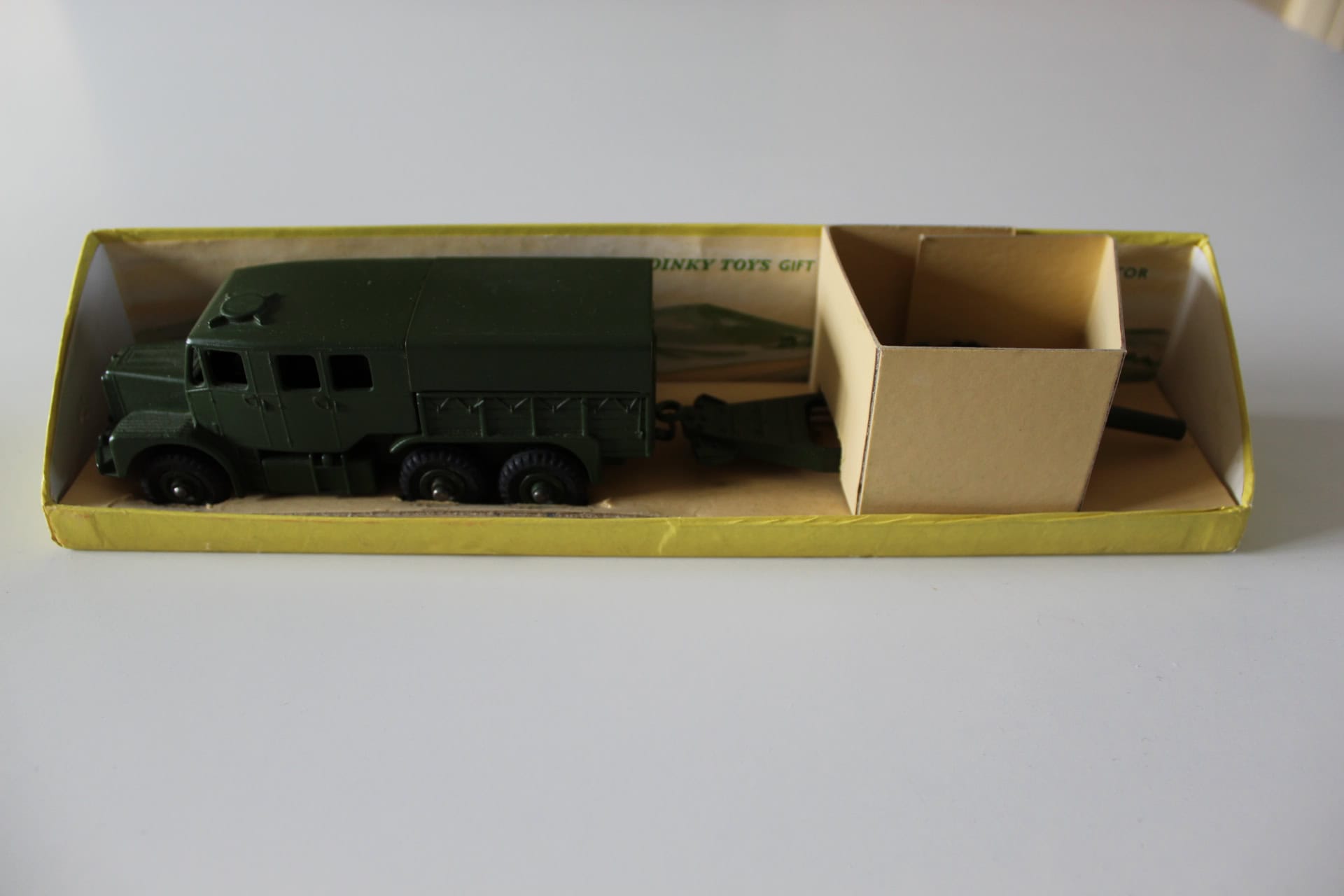 Dinky Toys 695 gift set with green tractor and howitzer in original box.