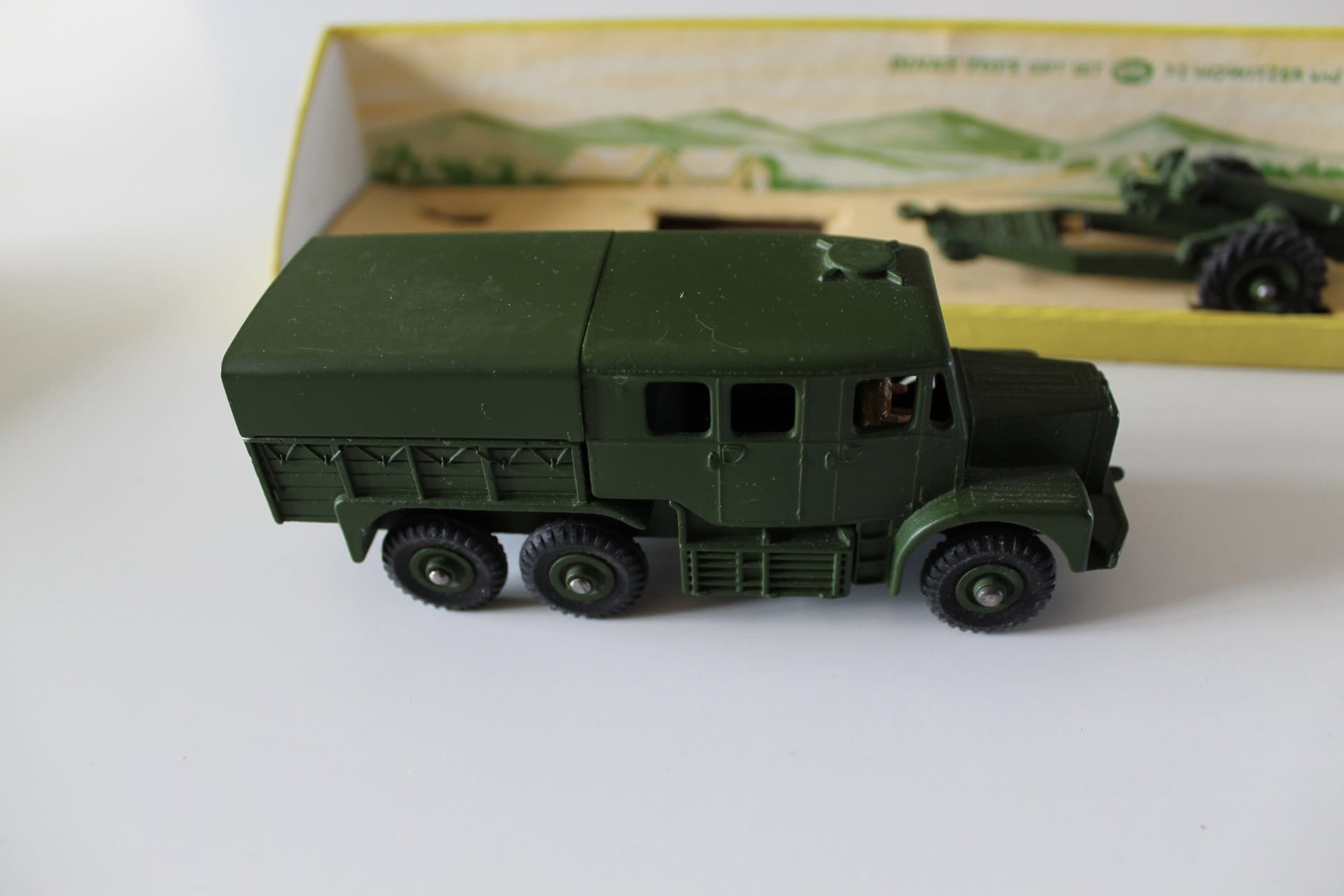 Vintage Dinky Toys military truck and artillery model for collectors.