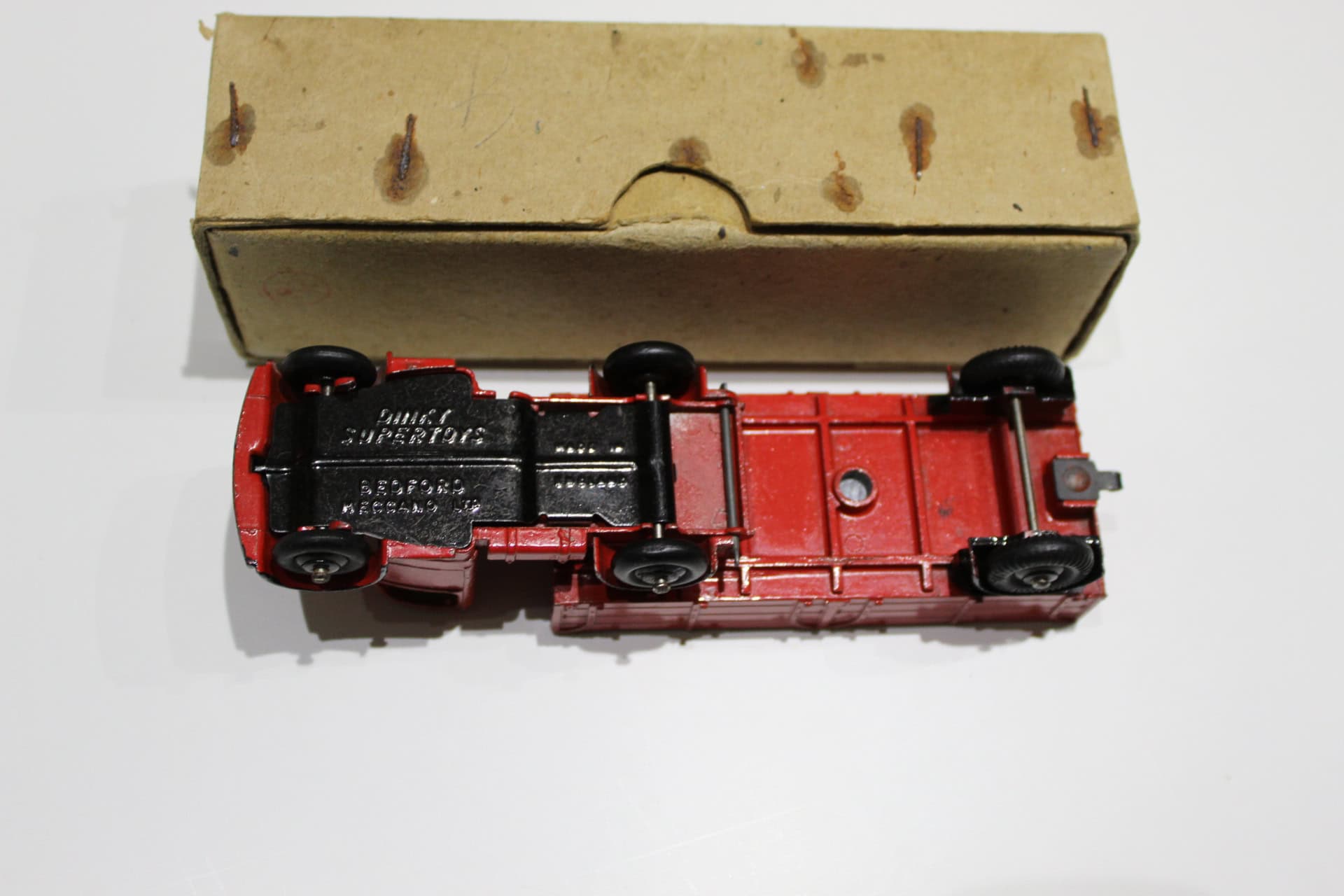 Vintage Dinky Toys Bedford articulated lorry model, red and black, with original box.