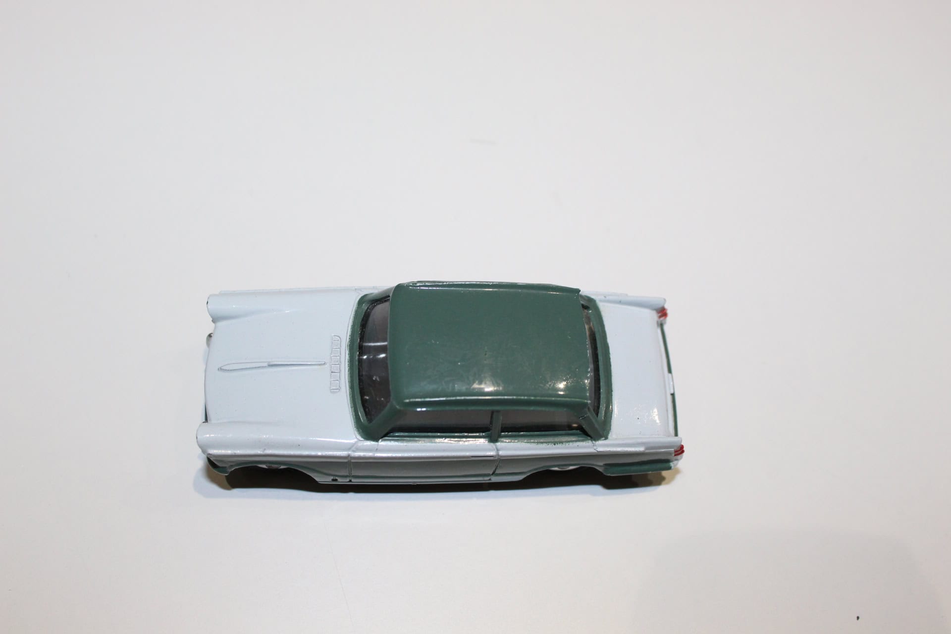 Dinky Toys 189 Triumph Herald diecast model car on white background.