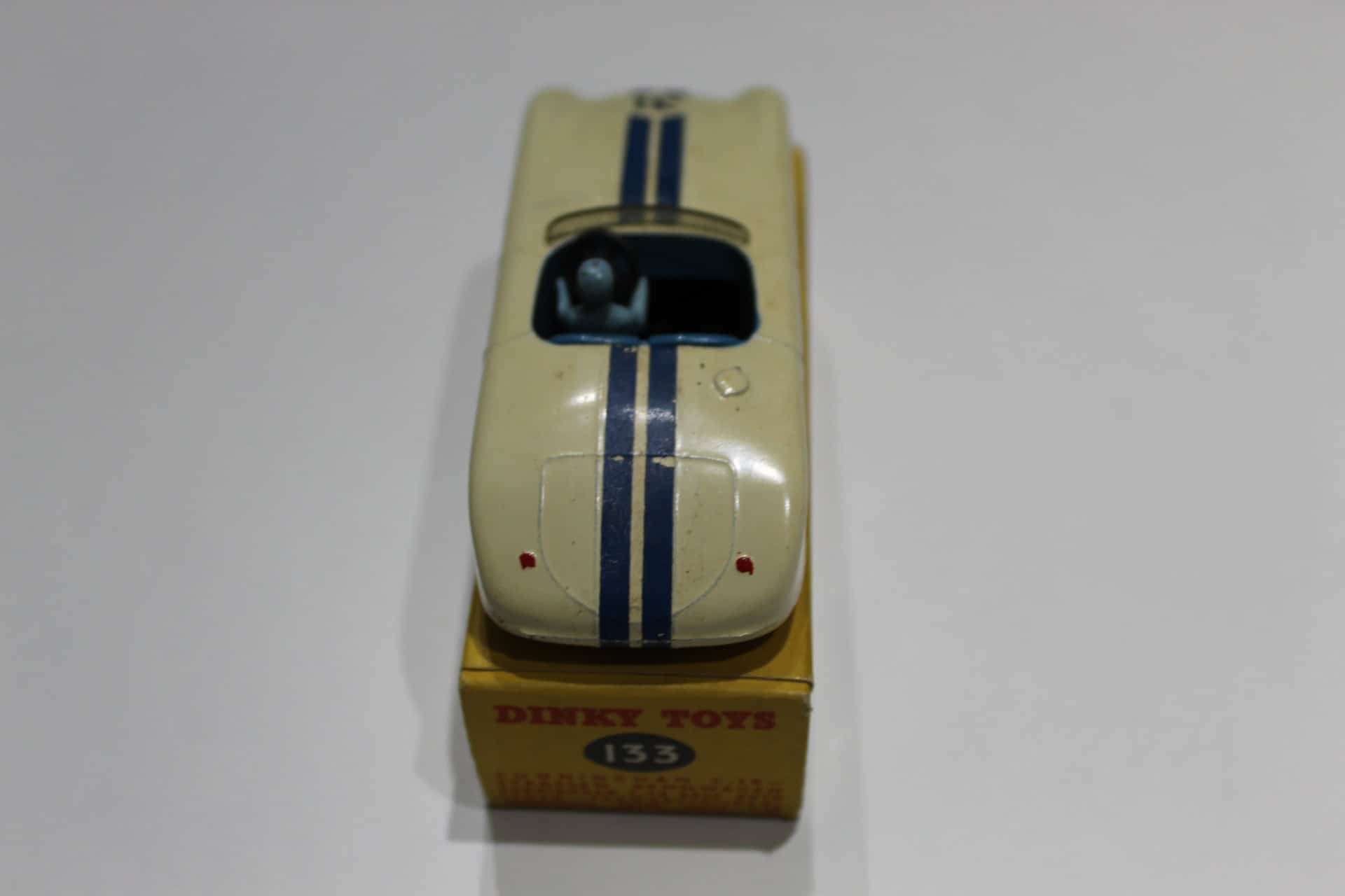 Dinky Toys 133 Cunningham C5-R racing car model in original box, vintage diecast collectible.