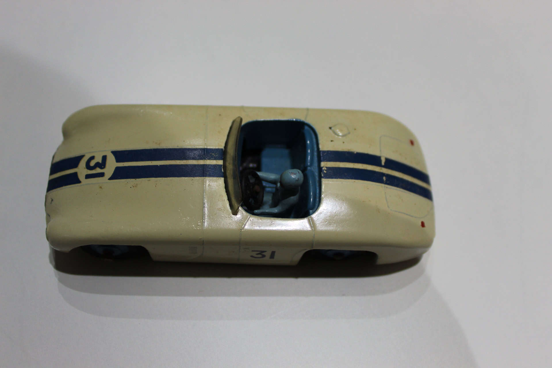 Dinky Toys 133 Cunningham C5-R racing car model with detailed blue stripes and open cockpit.