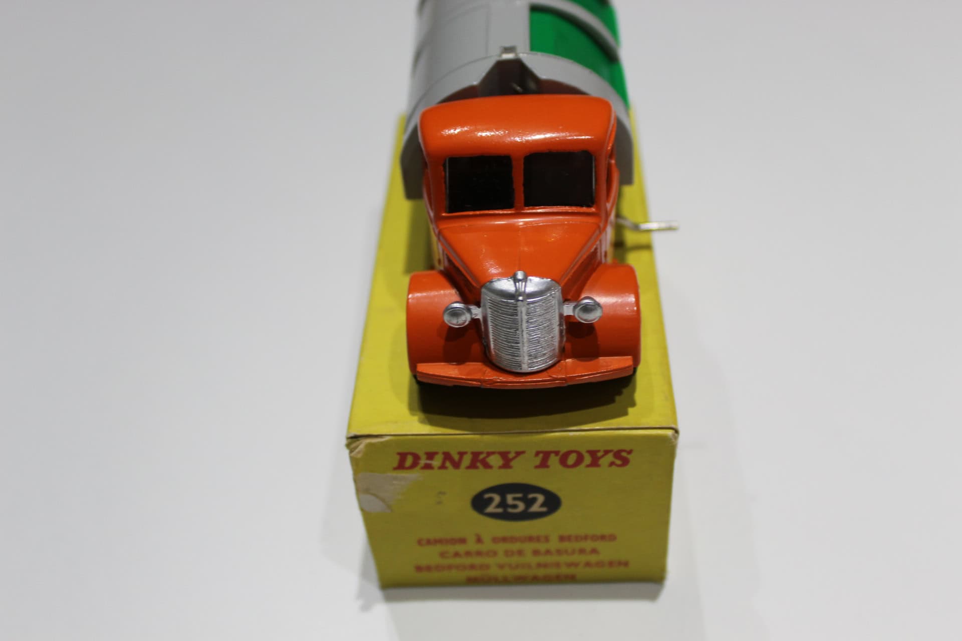 Vintage Dinky Toys refuse wagon model, collectible diecast toy vehicle for display.