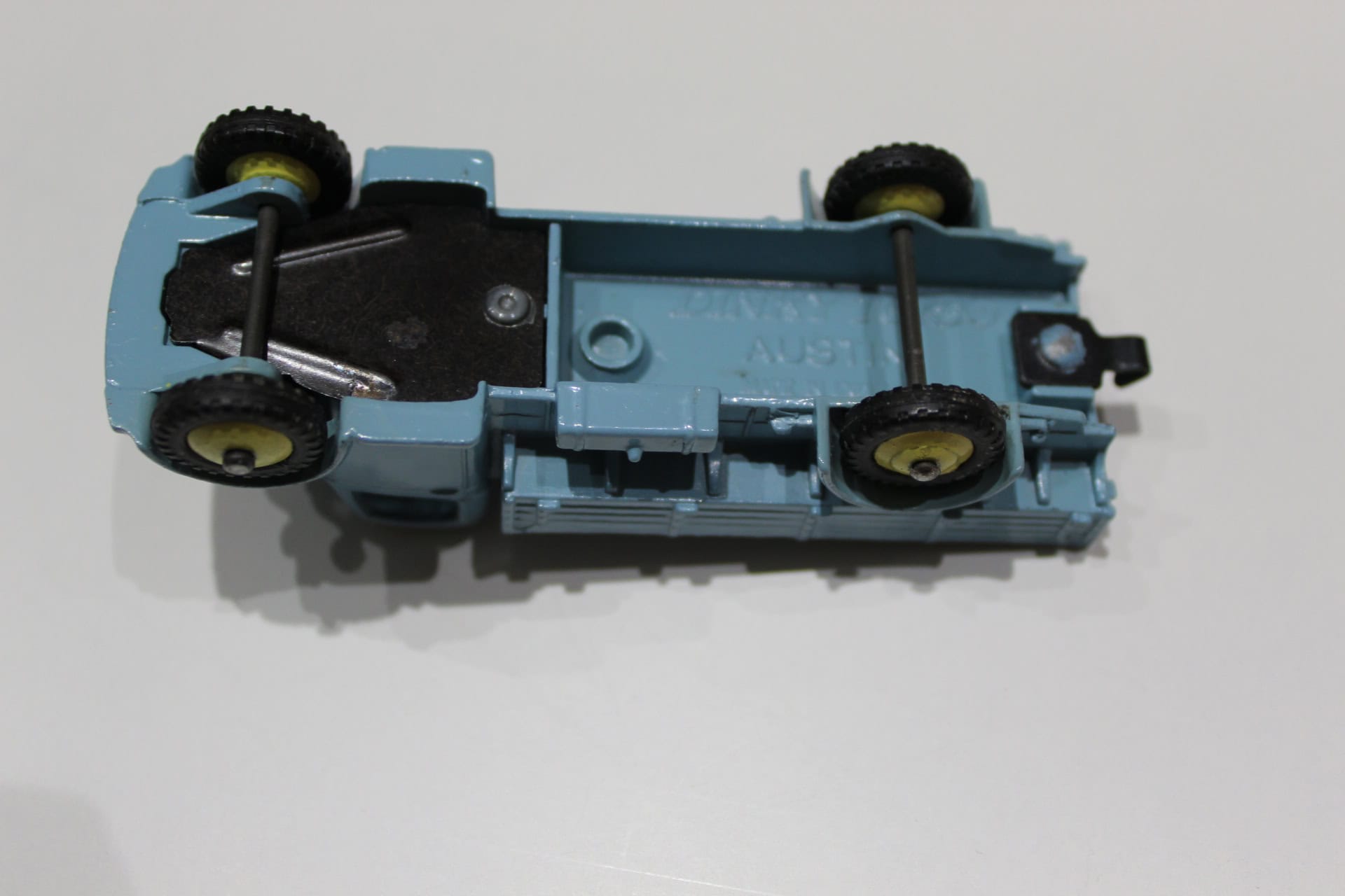 Dinky Toys 412 Austin Wagon diecast model, underside view, vintage toy collectible.