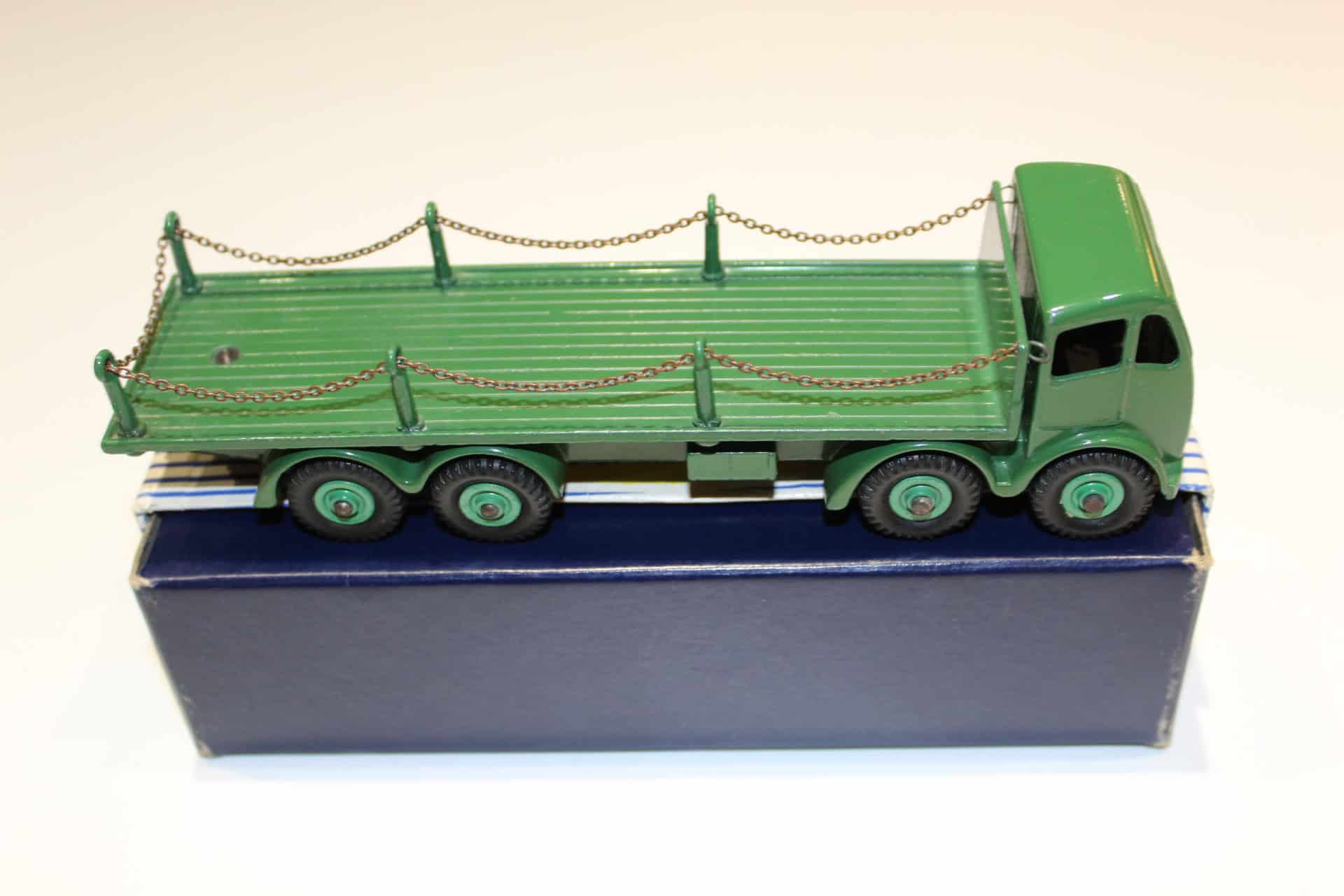 Detailed green Foden chain lorry model with side chains and cab.
