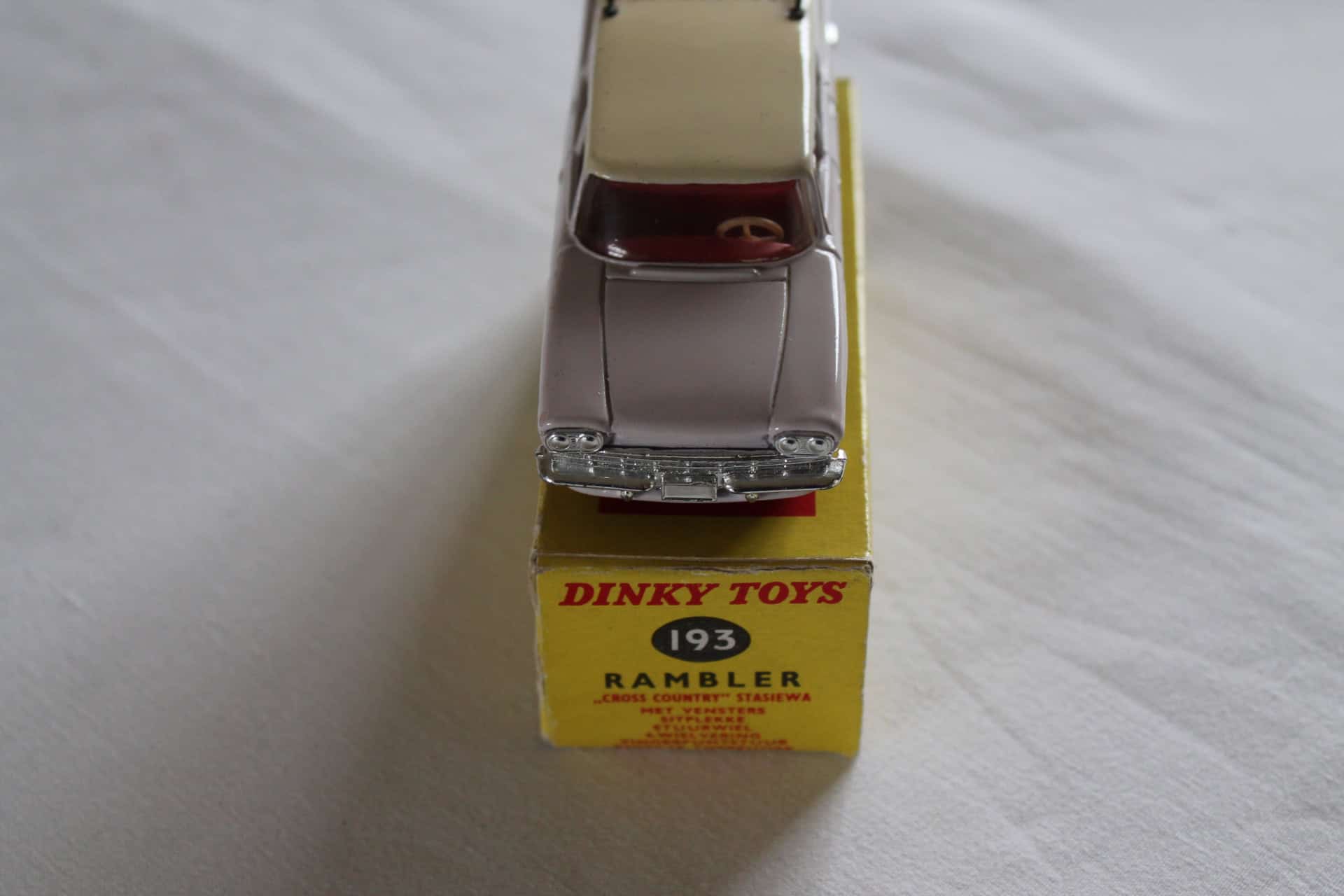 Dinky Toys 193 South African Rambler Cross Country Station Wagon model on yellow box.