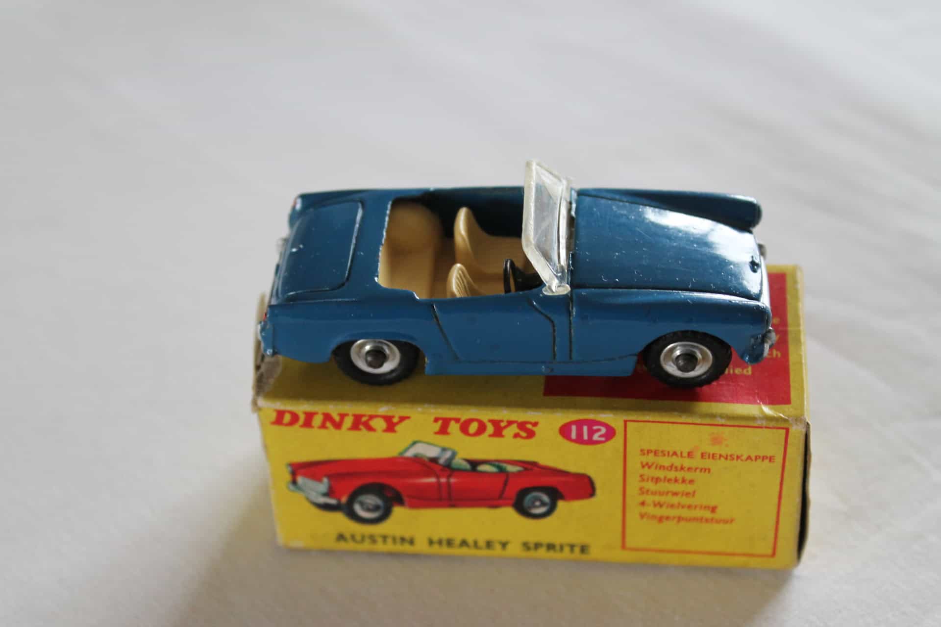 Vintage Dinky Toys 112 Austin Healey model on original box, rare South African issue.