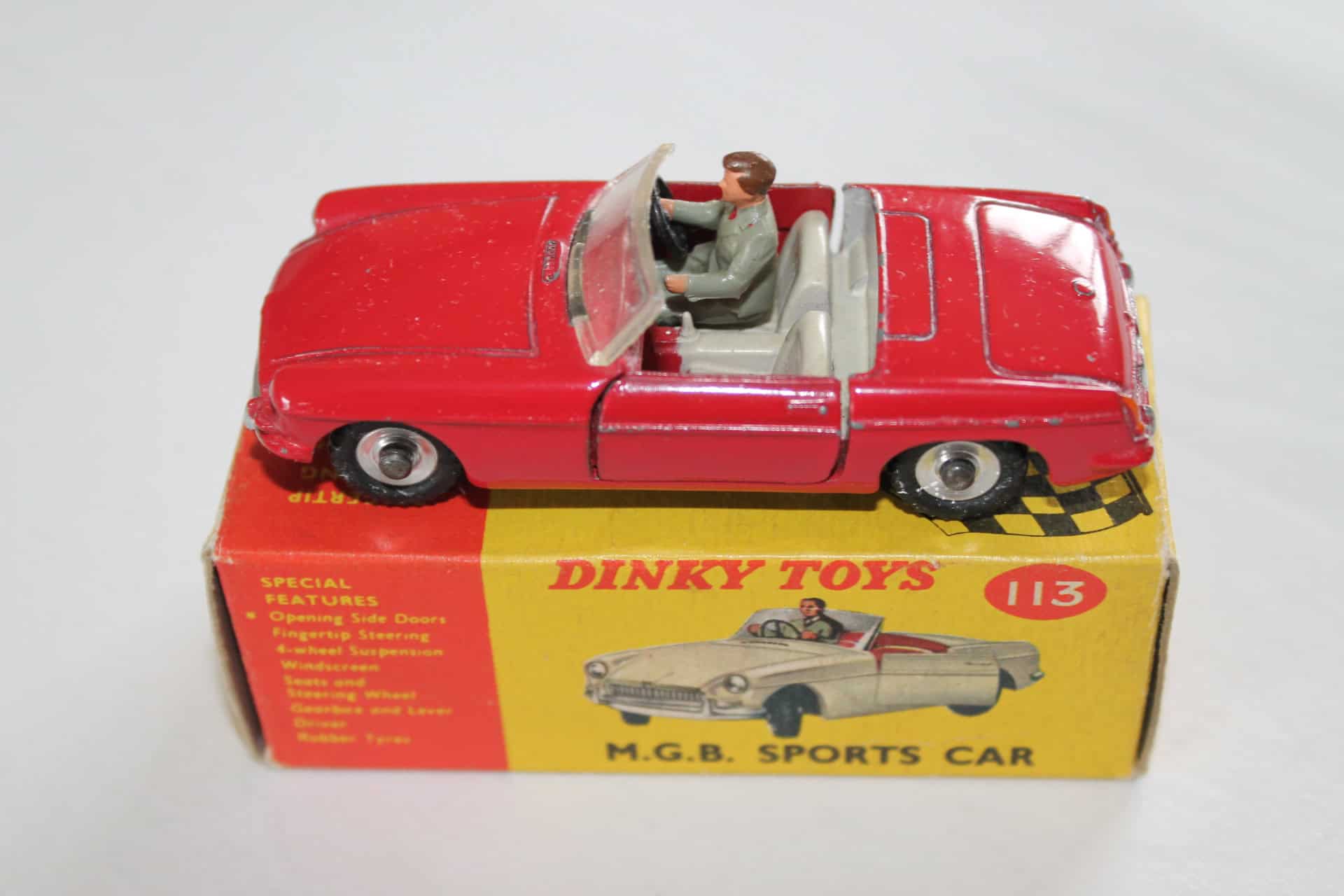 Dinky Toys 113 M.G.B. Sports Car rare South African issue, detailed diecast model with driver figure.