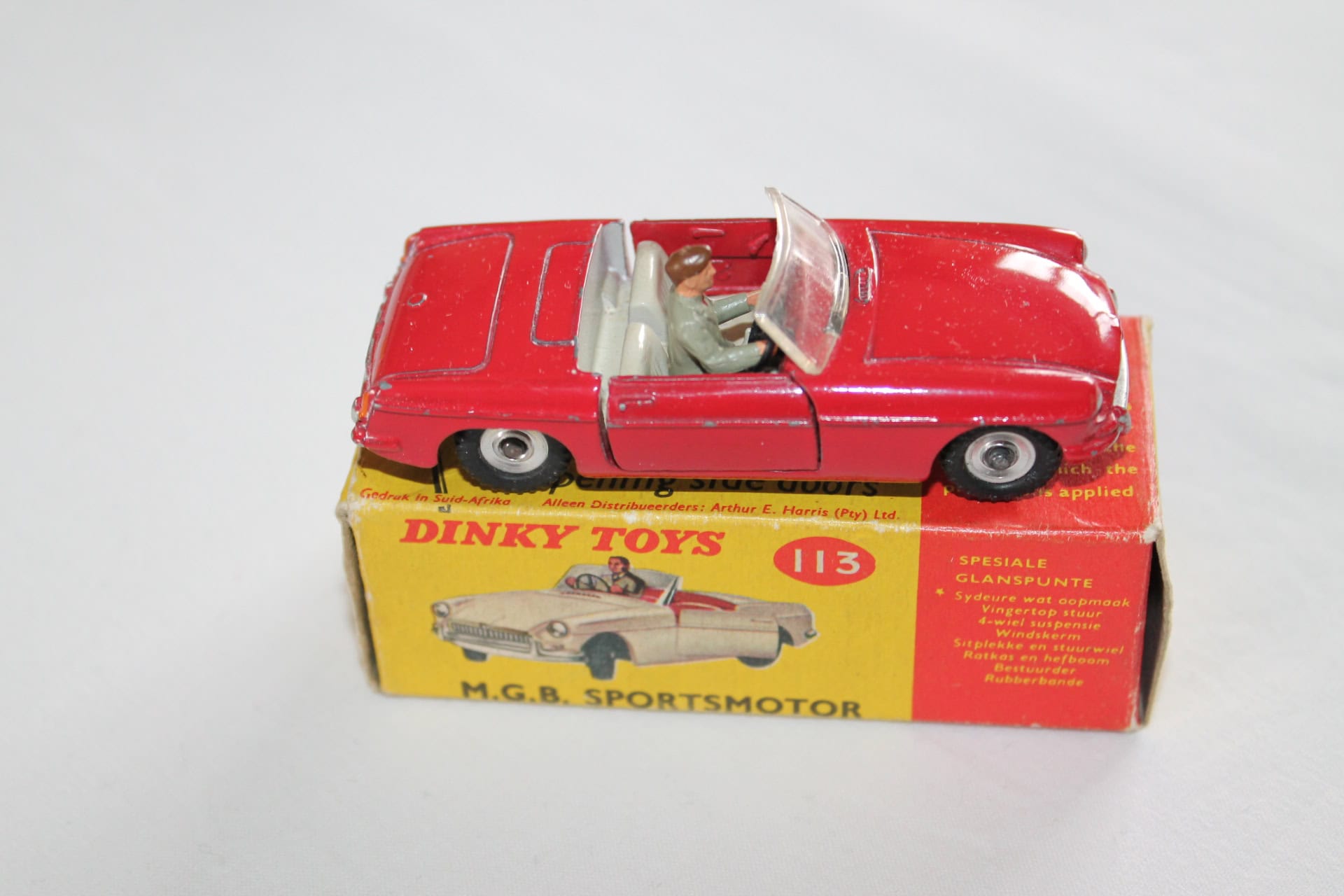 Vintage Dinky Toys 113 M.G.B. sports car model on original box, rare South African issue.