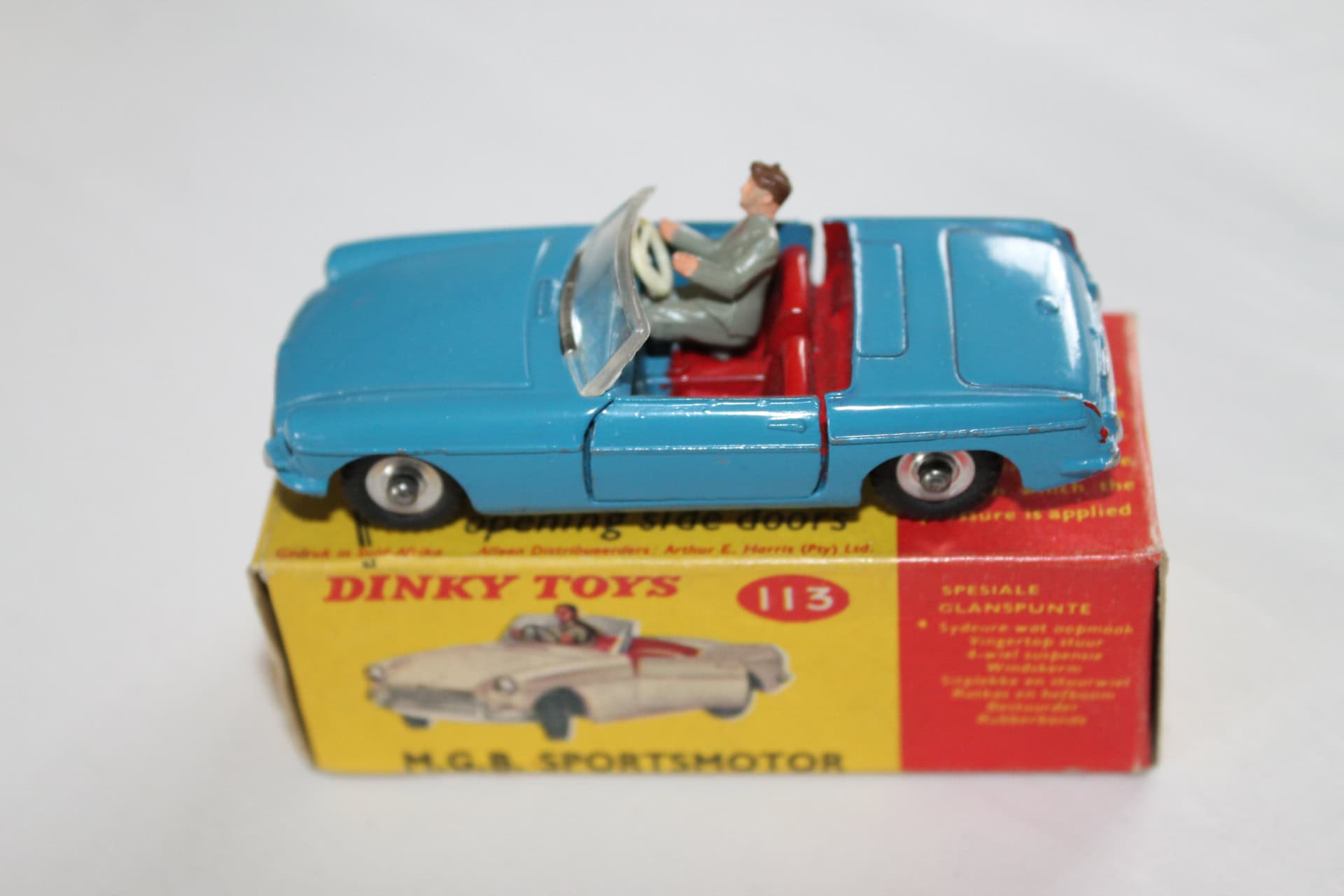 Dinky Toys 113 M.G.B. sports car model on its original box, South African issue, vintage diecast col.