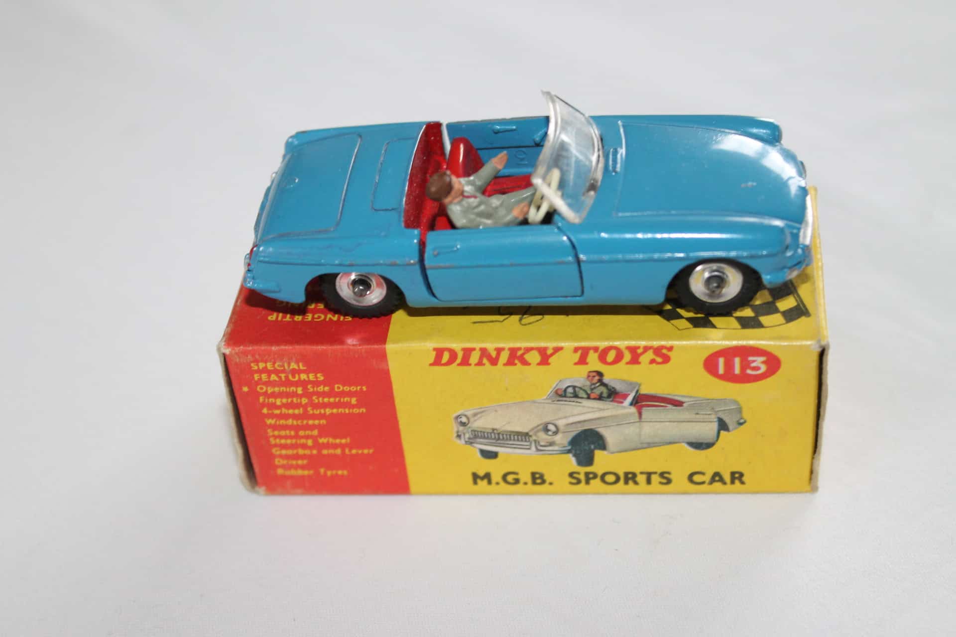 Vintage Dinky Toys 113 M.G.B. sports car model on original box.
