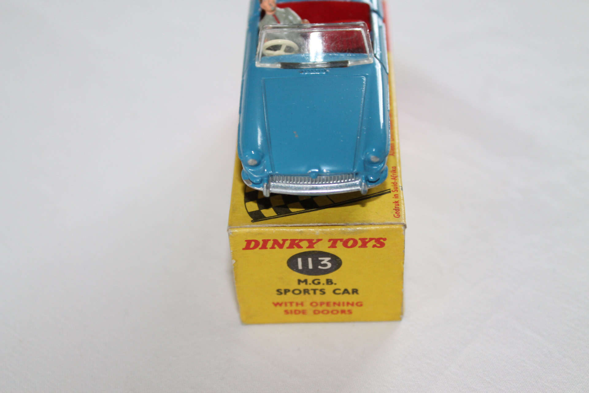 Dinky Toys 113 M.G.B. sports car model, rare South African issue, vintage diecast collectible.