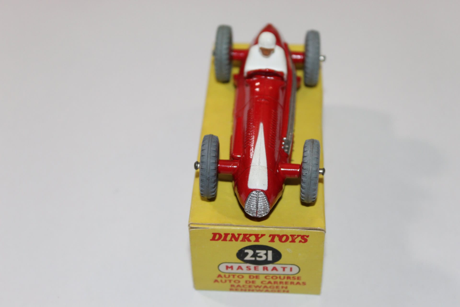 Dinky Toys 231 Maserati racing car model in red with yellow display box.