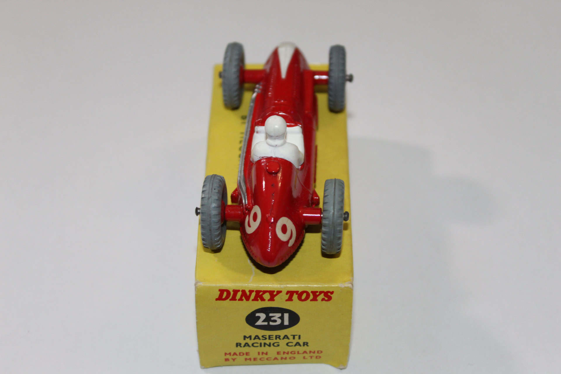 Dinky Toys 231 Maserati racing car model on display, vintage diecast collectible from the 1960s.