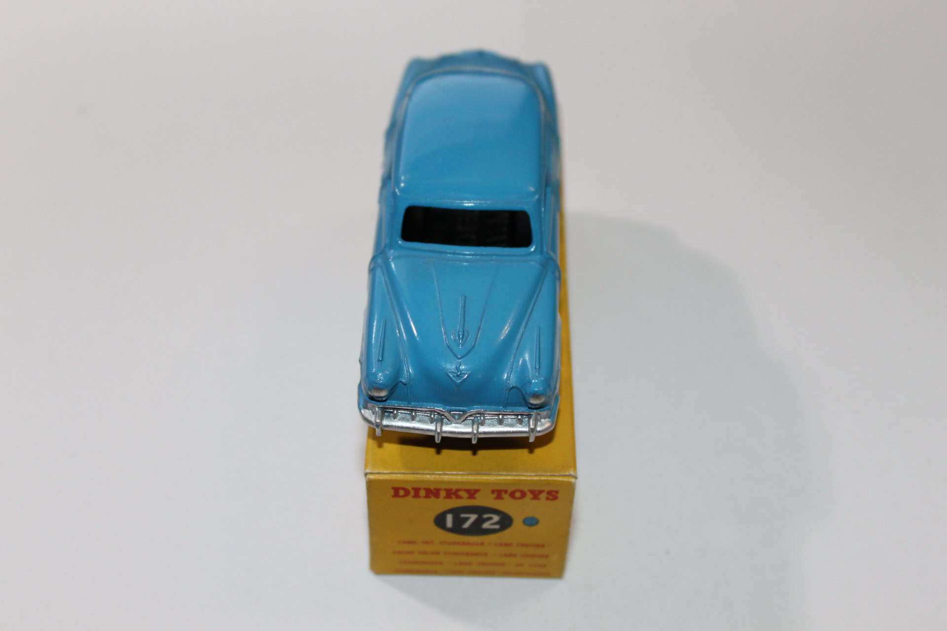 Dinky Toys 172 Studebaker Land Cruiser diecast model on display with original box.