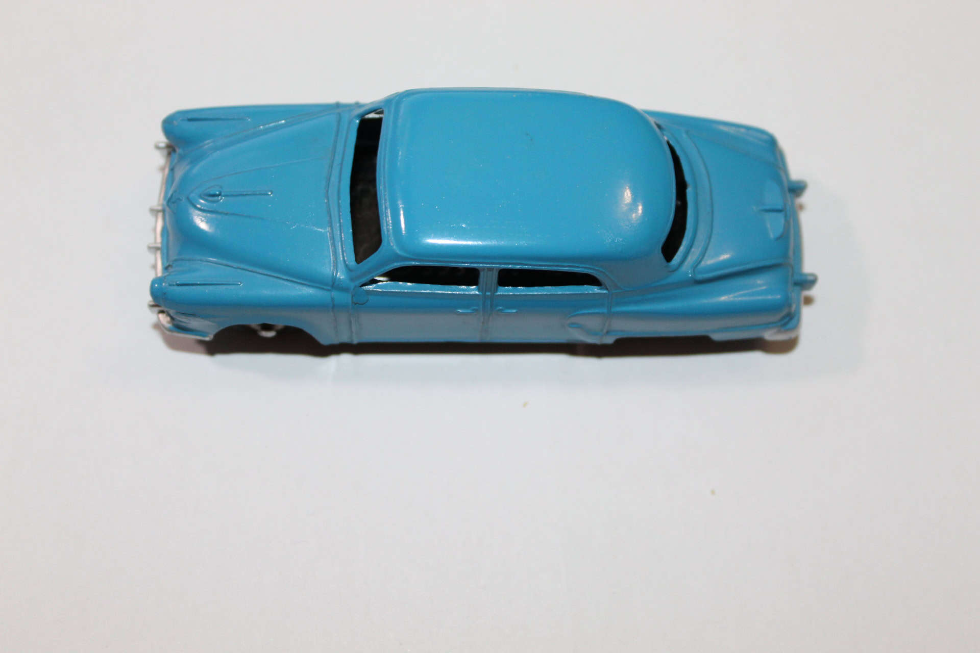 Dinky Toys 172 Studebaker Land Cruiser diecast model in blue, vintage toy car.