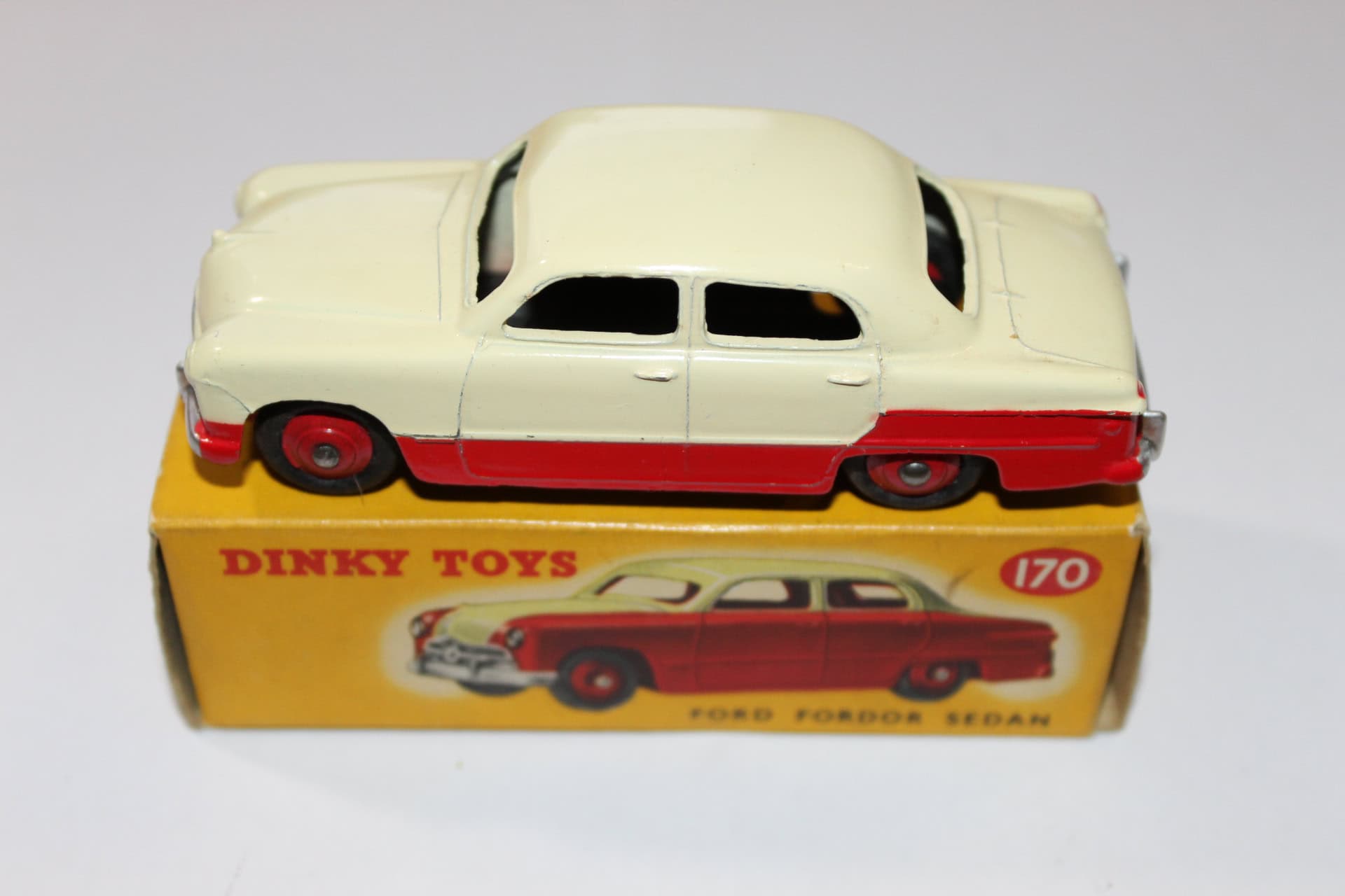 Vintage Dinky Toys 170 Ford Forder Lowline diecast model car, collectible toy, yellow and red.