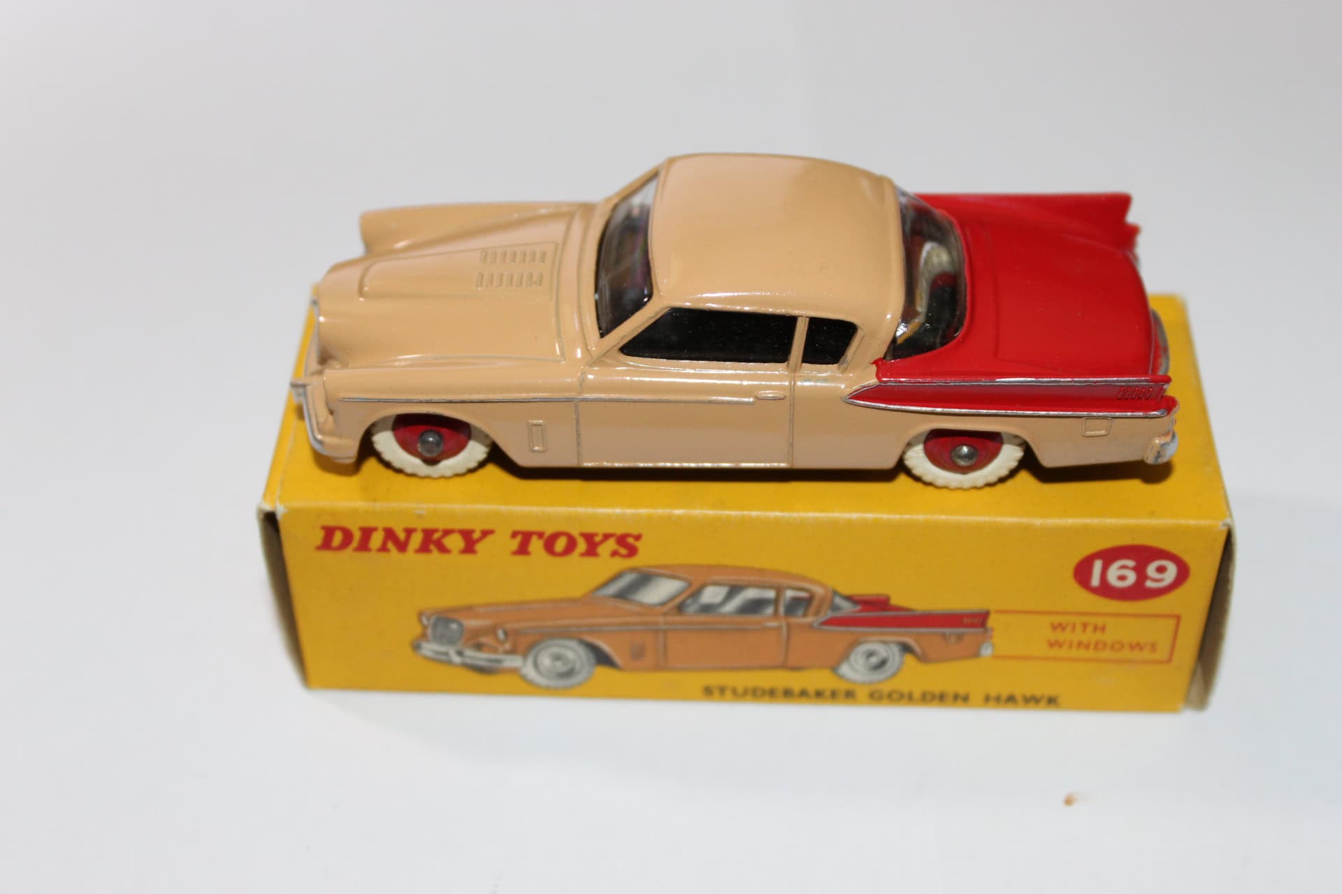 Vintage Dinky Toys 169 Studebaker Golden Hawk model car on original box.