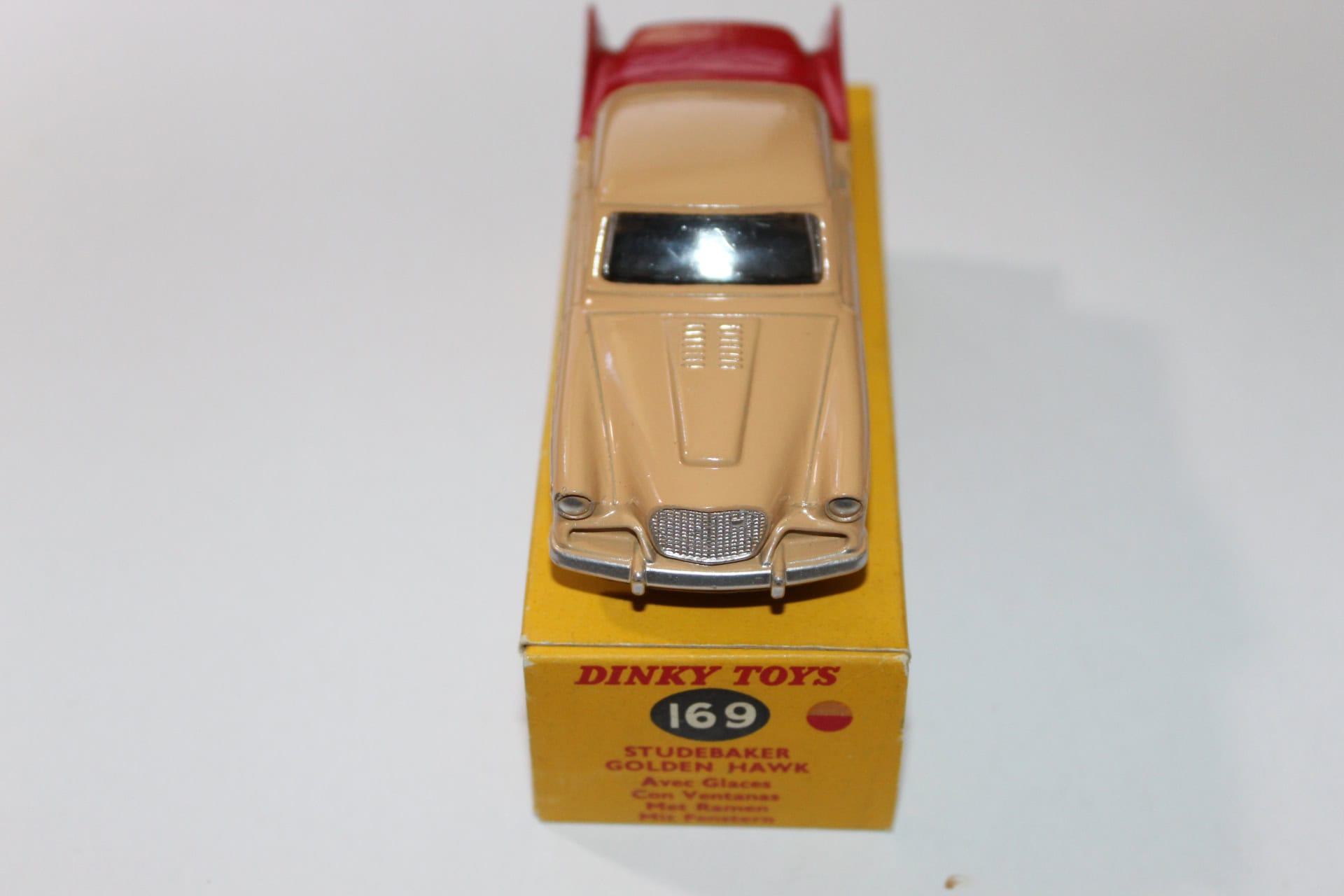 Dinky Toys 169 Studebaker Golden Hawk diecast model on original box, collectible vintage toy.