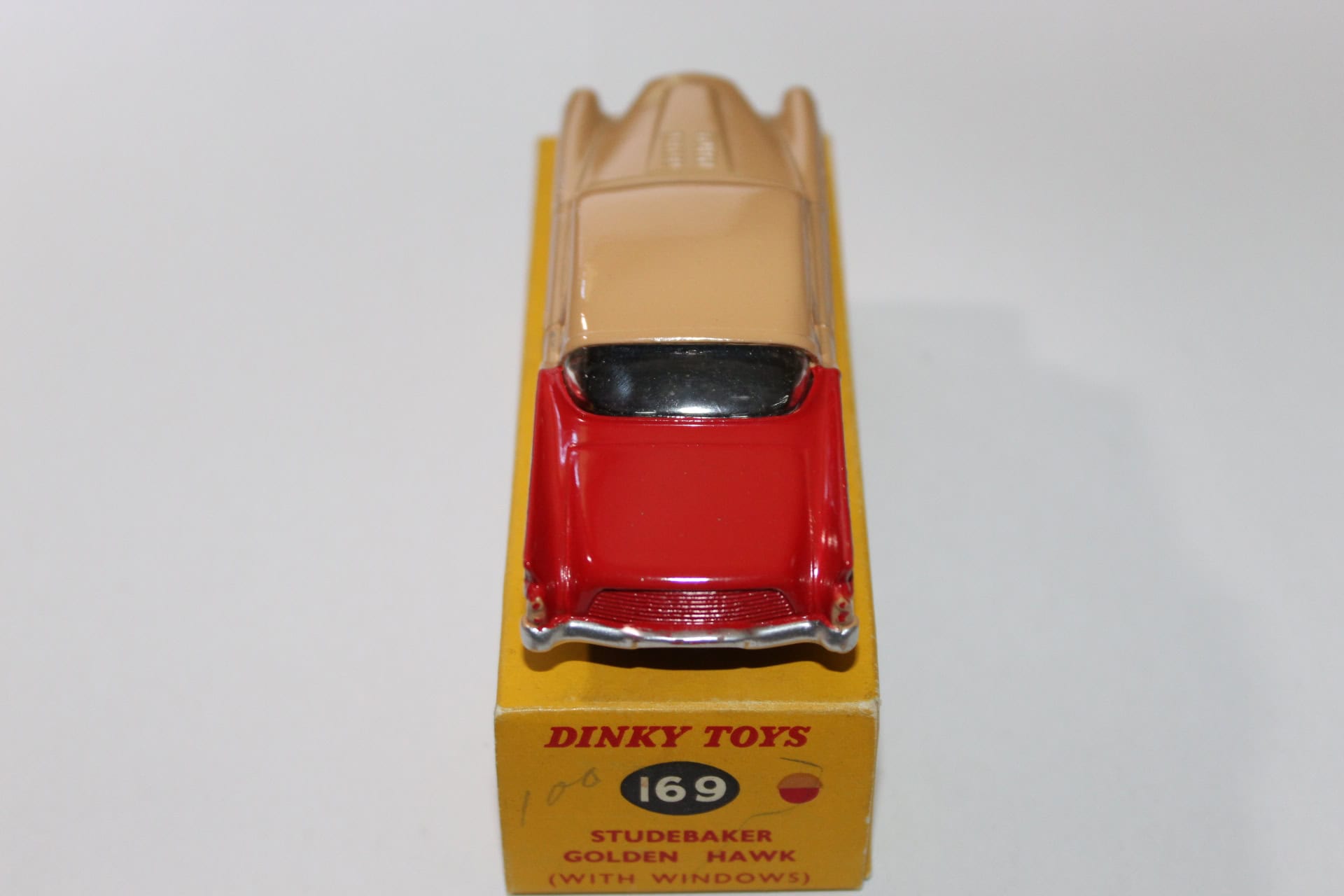 Vintage Dinky Toys 169 Studebaker Golden Hawk diecast model car with windows.