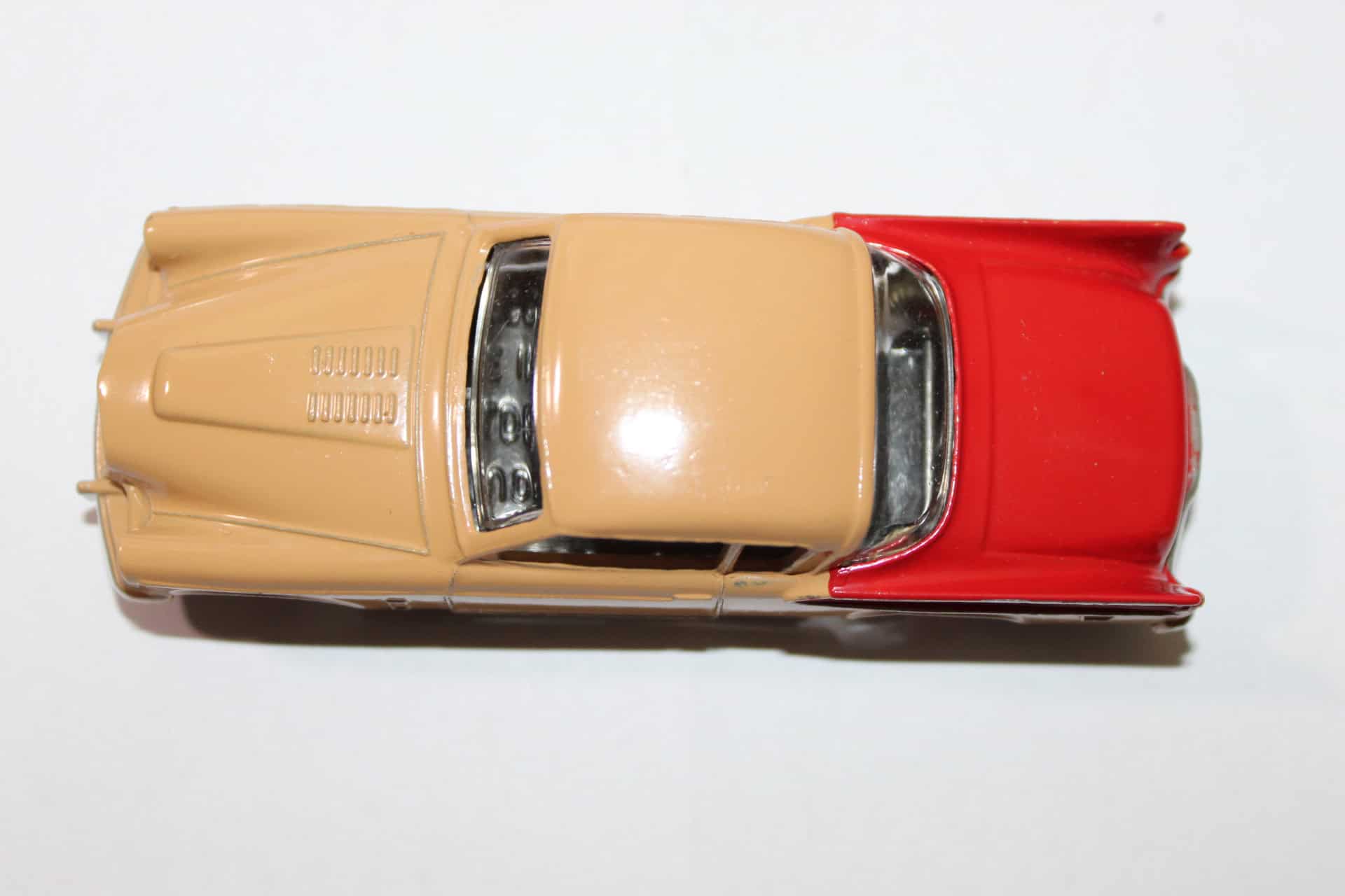 Vintage Dinky Toys 169 Studebaker Golden Hawk diecast model car, red and beige, collectible toy.