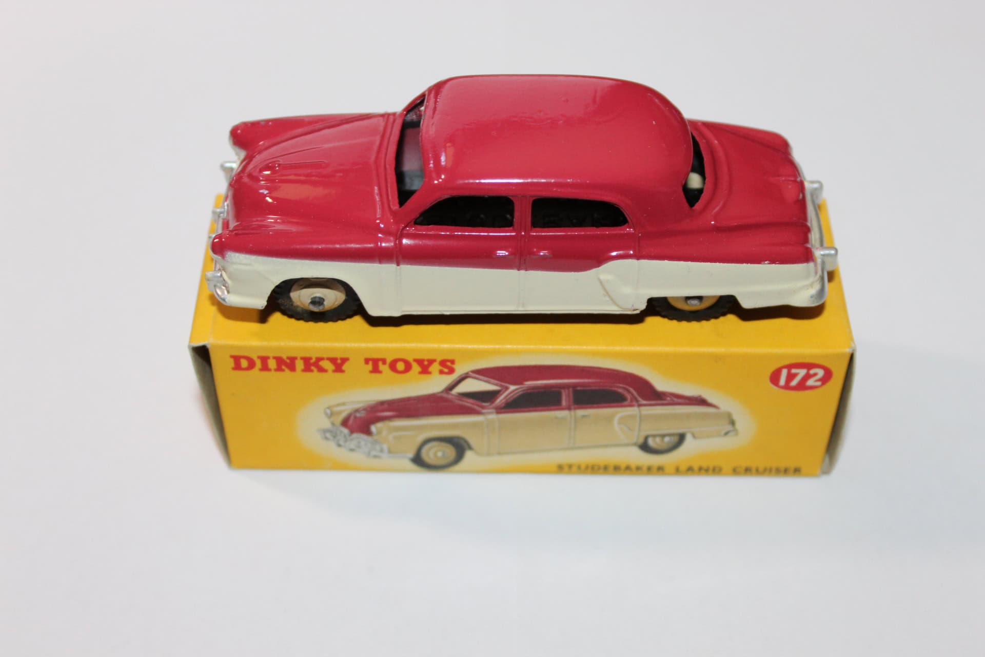 Vintage Dinky Toys 169 Studebaker Golden Hawk diecast model car on box.
