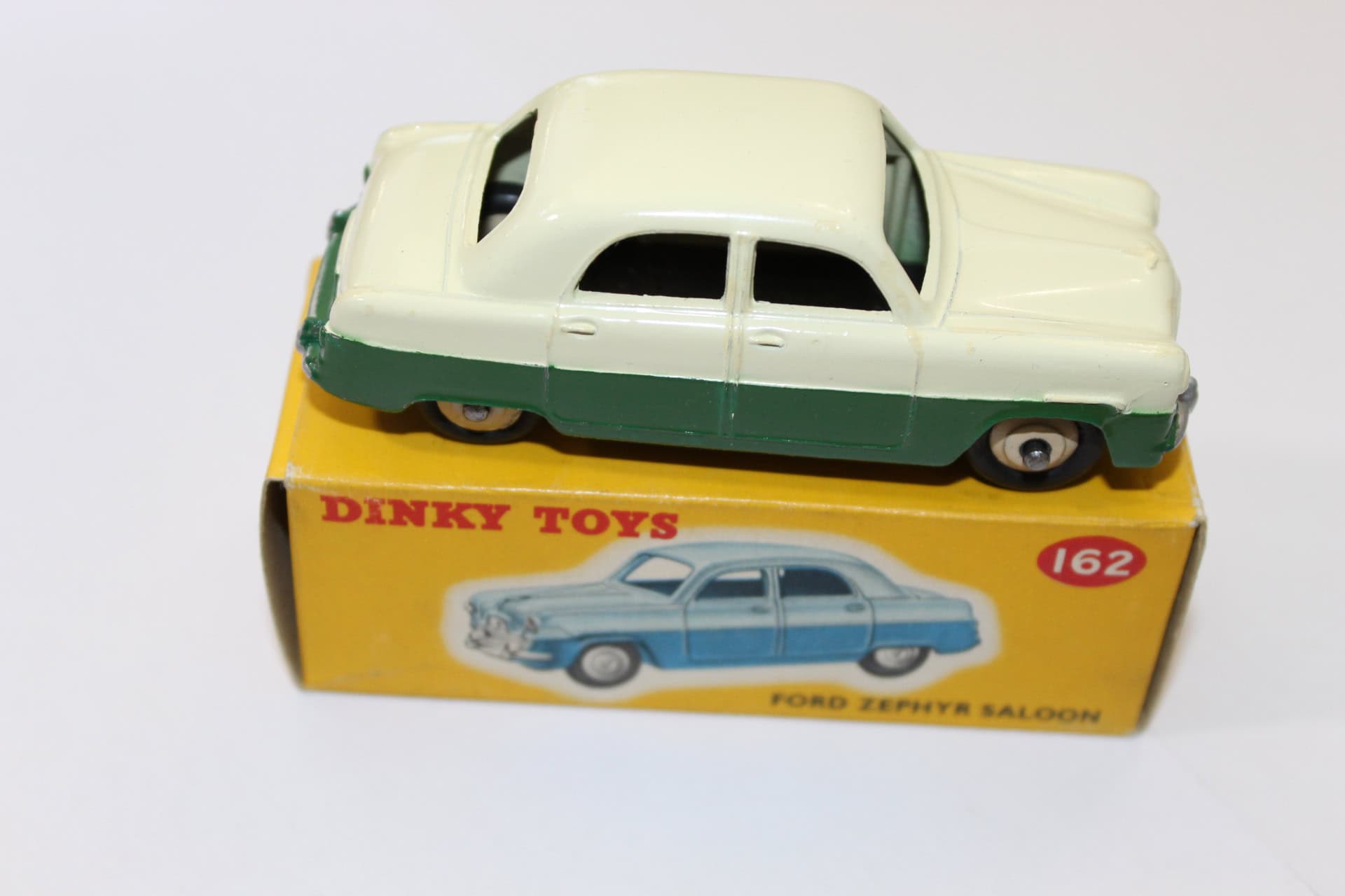 Vintage Dinky Toys 162 Ford Zephyr model in green and cream colors.