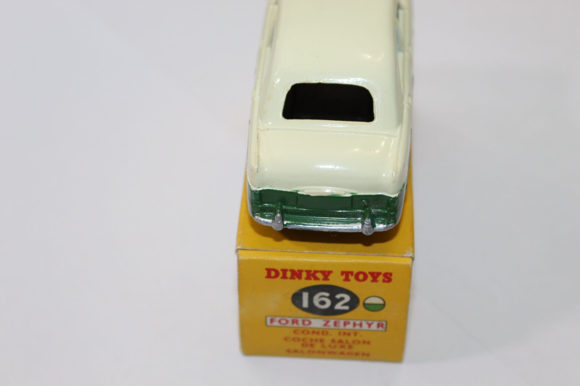Vintage Dinky Toys 162 Ford Zephyr in green and cream, displayed on original box.